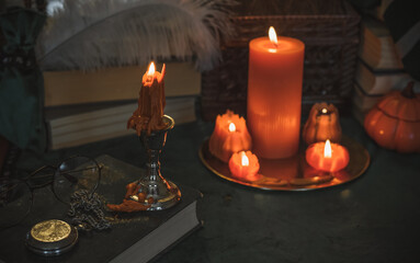 Halloween home decoration with pumpkin candles and other stuff. October time