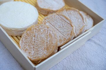 Rocamadour white and aged soft goat AOC cheese with soft rind produced on farm in Perigord and Quercy takes its name from village of Rocamadour in departement Lot, France close up