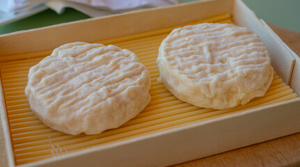 French cheeses collection, soft round white Saint-Felicien cow's milk cheese with white mold from Rhone-Alpes region of France