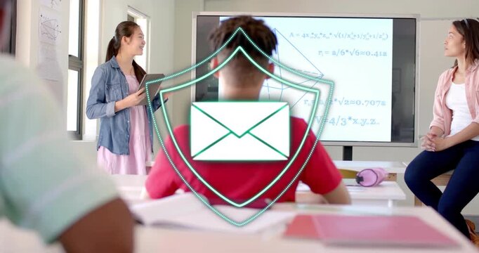 Presenter gesturing particles forming shield envelope linking monitors as students watching lesson