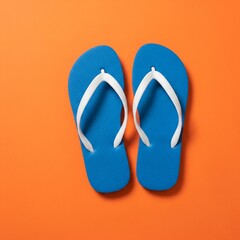 Fototapeta premium flip flops isolated on orange background 