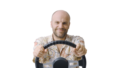 Man holding a steering wheel and driving an invisible car