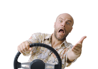 Aggressive driver gesturing and holding the steering wheel