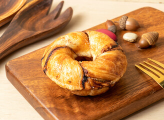 Chocolate Glazed Doughnut on a Wooden Board side view of hong kong food