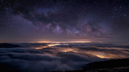 Starry night above clouds