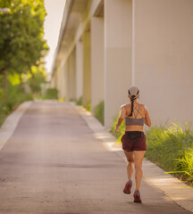 woman running on the road street miami 