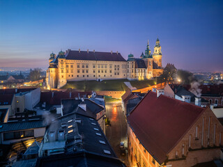 Wawel castle and cathedral in the night over Kanonicza street, Krakow, Poland