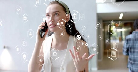 Business professional walking answering business call activating finance icons negotiating terms - Powered by Adobe