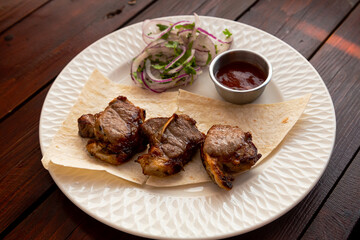 Lamb apple shashlik with fried tomato sauce and lavash