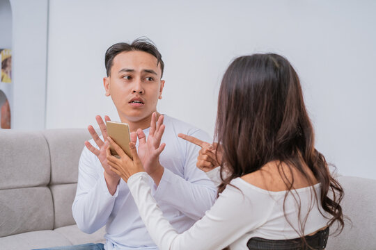 A couple engages in a heated discussion, highlighting their relationship conflicts