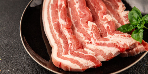 Bacon slice lard with meat slices pieces pork tenderloin portion size natural product tasty snack fresh delicious gourmet food background on the table rustic top view copy space