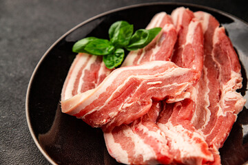 Bacon slice lard with meat slices pieces pork tenderloin portion size natural product tasty snack fresh delicious gourmet food background on the table rustic top view copy space