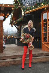 beautiful woman in Christmas style. Girl walk at the street in new year mood