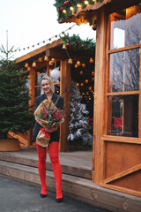 beautiful woman in Christmas style. Girl walk at the street in new year mood