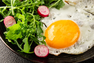 Eggs breakfast black pudding, egg, vegetables, arugula portion size natural product tasty snack fresh delicious gourmet food background on the table rustic top view copy space