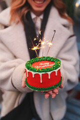Beautiful New Year decorations, in the house, in the studio, Cake with the inscription Merry Christmas