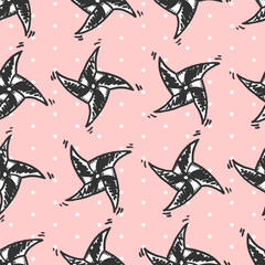 Vector seamless pattern with freehand drawn cartoon windmills on pink background with polka dots