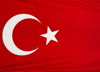 Obraz premium Turkish national flag with white crescent and star on a red background. Identity, patriotism and cultural pride in national symbols.