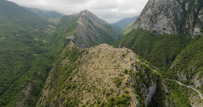 Aerial view of the rugged mountains, lush forests, and winding roads, creating a stunning landscape of natural beauty, Anversa degli Abruzzi, Abruzzo, Italy.