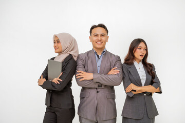 A confident and ambitious business team is posing together while dressed in formal wear attire