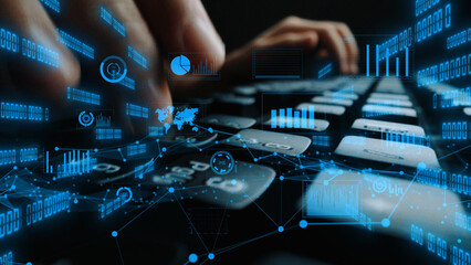 A close-up view of hands typing on a keyboard surrounded by floating digital data elements. This image captures the essence of technology and analytics in a modern workspace. Xenic