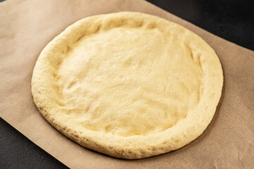 Raw pizza dough making pizza base tasty snack fresh delicious gourmet food background on the table rustic top view copy space