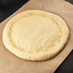 Raw pizza dough making pizza base tasty snack fresh delicious gourmet food background on the table rustic top view copy space