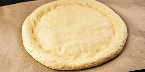 Raw pizza dough making pizza base tasty snack fresh delicious gourmet food background on the table rustic top view copy space