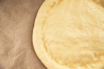 Raw pizza dough making pizza base tasty snack fresh delicious gourmet food background on the table rustic top view copy space