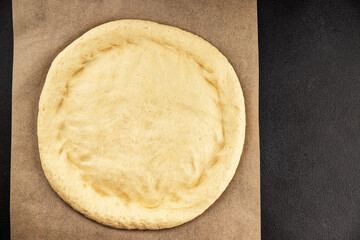 Raw pizza dough making pizza base tasty snack fresh delicious gourmet food background on the table rustic top view copy space