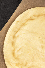 Raw pizza dough making pizza base tasty snack fresh delicious gourmet food background on the table rustic top view copy space