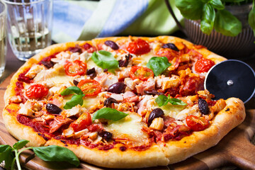 Delicious pizza served on wooden pizza board on brown background