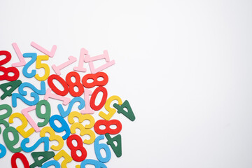 Bright wooden numbers on a colored background. Close-up of colorful wooden numbers back to school.
