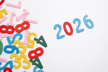 Colored numbers of the calendar for 2026 on the background. Happy New Year 2026 card.