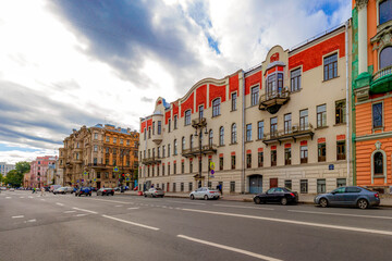 Beautiful Art Nouveau mansion facade with balconies, bas-reliefs and ornate decorative details in historic city center. Saint Petersburg, Russia.
