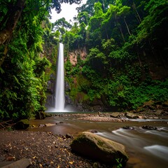 Lush waterfall cascading down rocky gorge