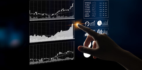 A person interacts with a digital data screen showcasing stock market trends through graphs and charts, highlighting modern financial analysis and investment strategies. Impute