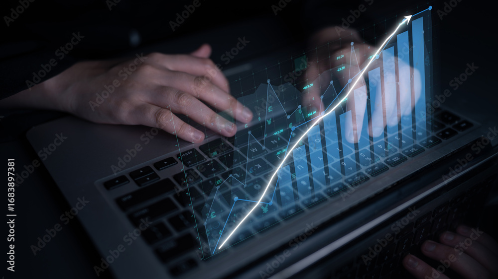 Wall mural close-up of hands using a laptop with digital graphs displayed above the keyboard, symbolizing data 