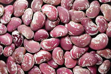 Beans full frame. Pink speckled beans on a black