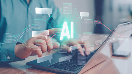 Businessman working on laptop with glowing AI hologram. Artificial intelligence, machine learning, and future digital technology concept for business and innovation.