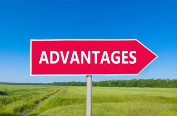 Advantages symbol. Concept word Advantages on beautiful red road sign. Beautiful blue sky green grass and forest peaceful nature background. Business advantages concept. Copy space.