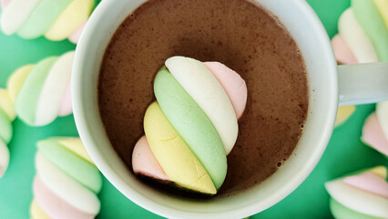 Close Up Cocoa Drink With Colourful Marshmallows In White Mug On Green Background — Dessert Texture Mockup With Copy Space