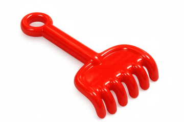 Red plastic rake toy isolated on transparent background, perfect for summer fun and beach play