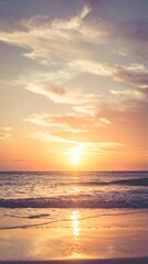 Obraz premium Warm Sunset Reflection on Tranquil Beach Coastline Ocean Water and Cloudy Sky