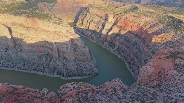 A breathtaking aerial view captures the majestic river bend of the Bighorn River, as seen from the Sullivan Knob Trail