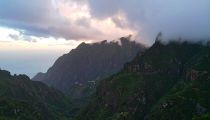 Mountain range at sunset, lush valleys