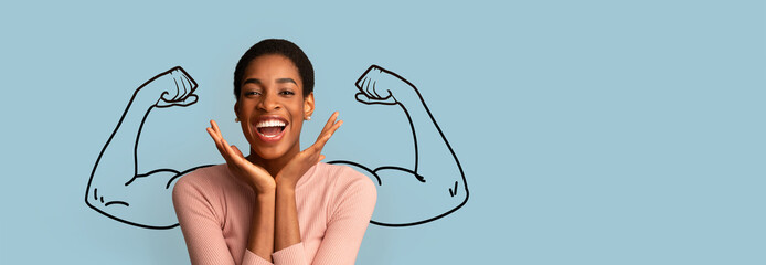 A joyful African American individual expresses strength and confidence, showcasing biceps against a...