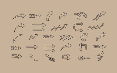 Fototapeta premium Collection of hand drawn arrow icons and symbols on a textured brown background