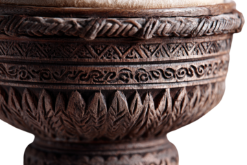 Close-up of intricately carved wooden drum