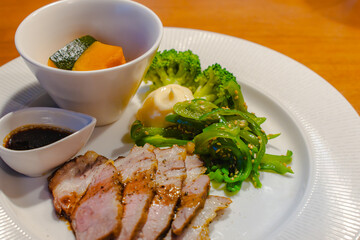 Dinner plate with pork sauté and assorted vegetables
